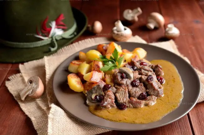 How Is Wild Game Like Deer and Boar Prepared in Styrian Cuisine?